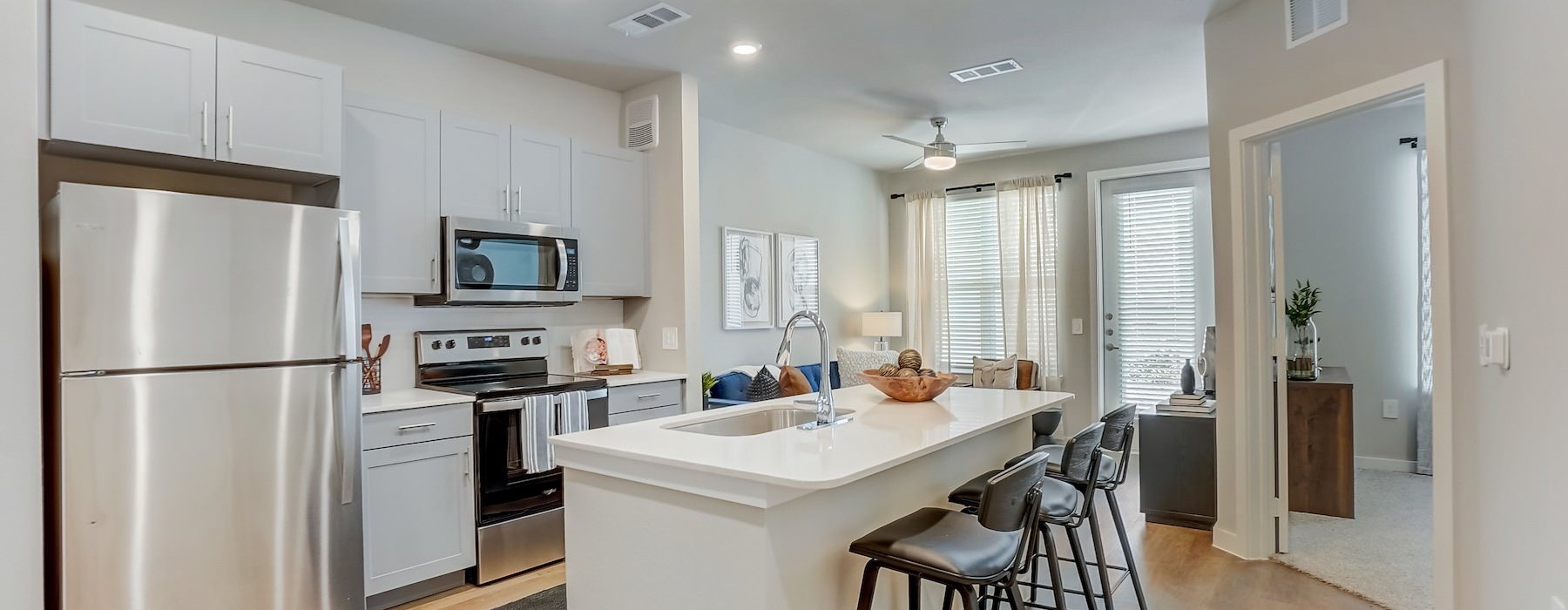 a kitchen with white cabinets