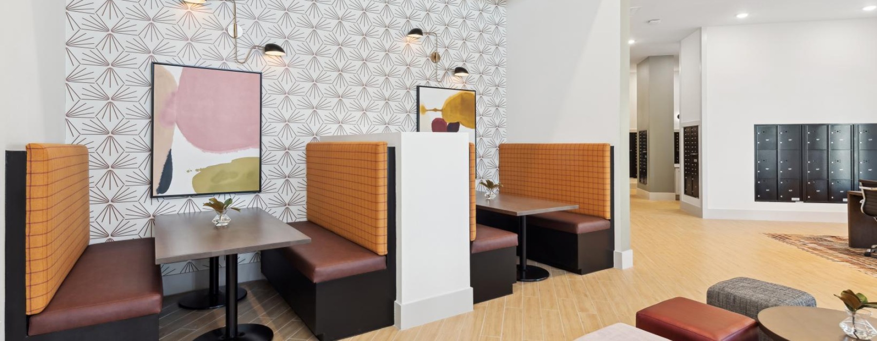 a room with booth seating and chairs