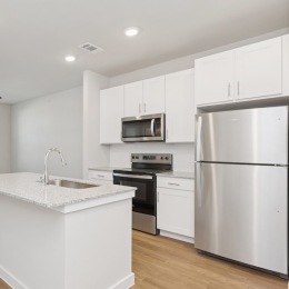 a kitchen with white cabinets