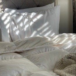 a bed with pillows
