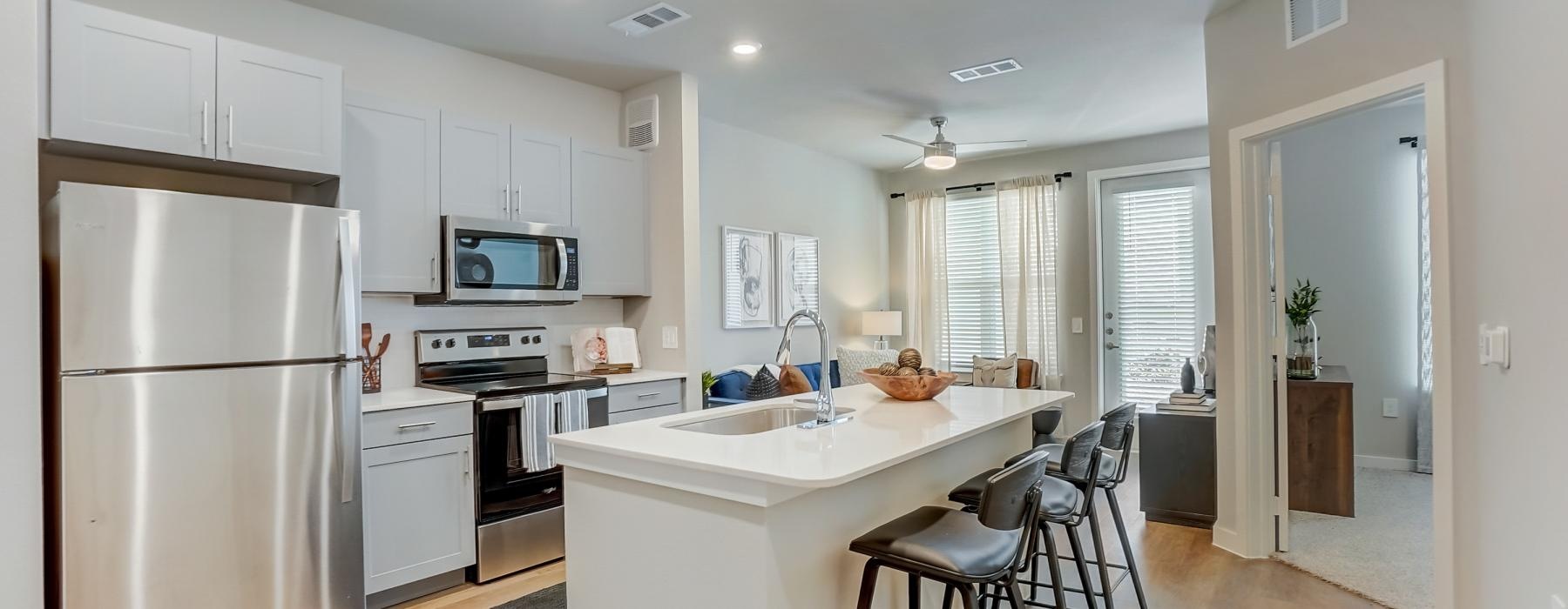 a kitchen with white cabinets