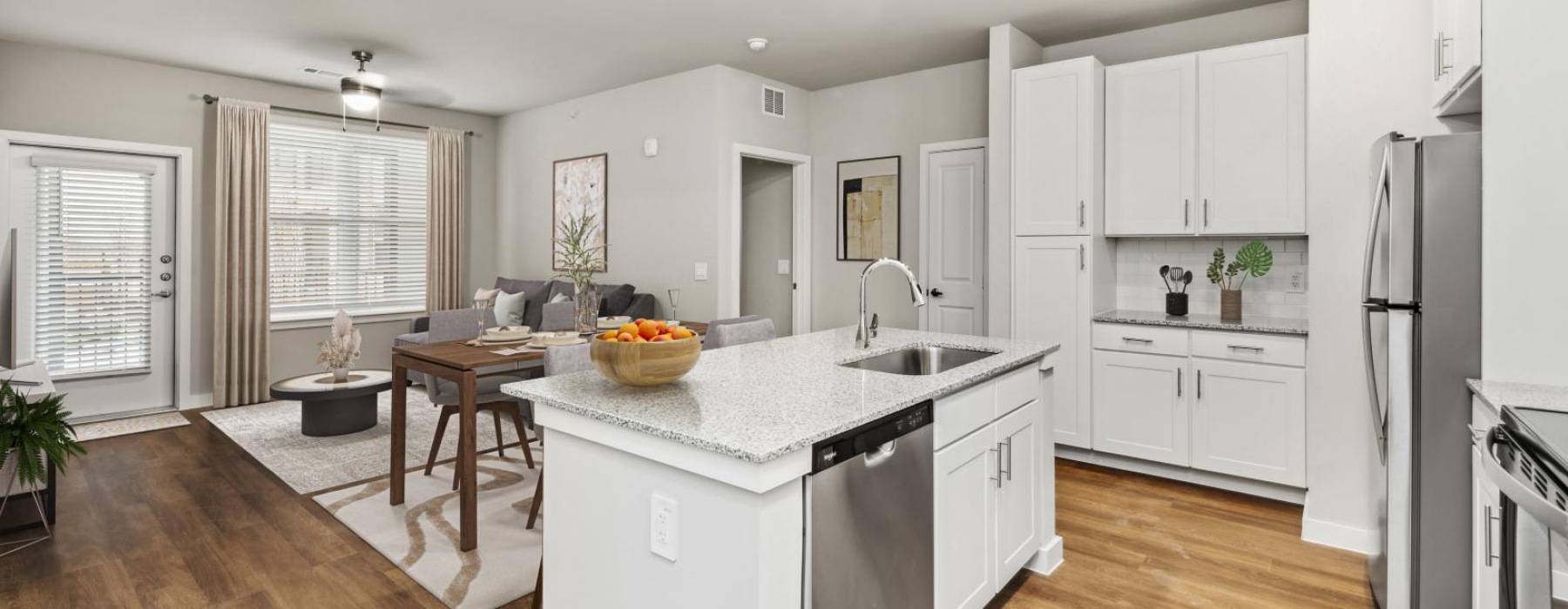 a kitchen with white cabinets